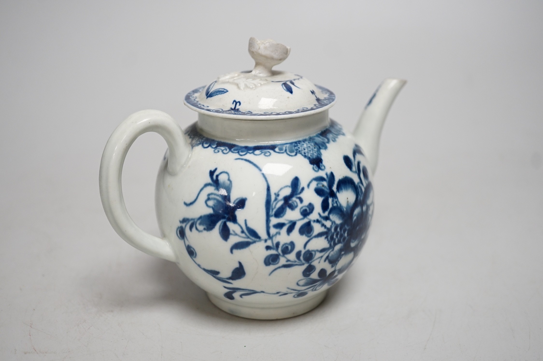 A Worcester Mansfield pattern teapot and cover with flower decoration and finial. 13cm tall